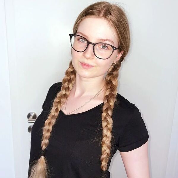 Double Pigtails Hairstyle - a woman wearing a eyeglasses