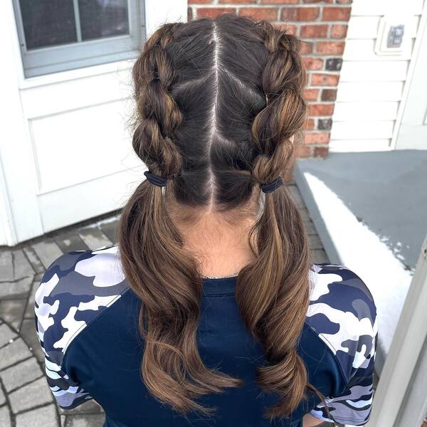 Half Up Twisted Pigtail Braids - a woman wearing a rush guard longsleeve
