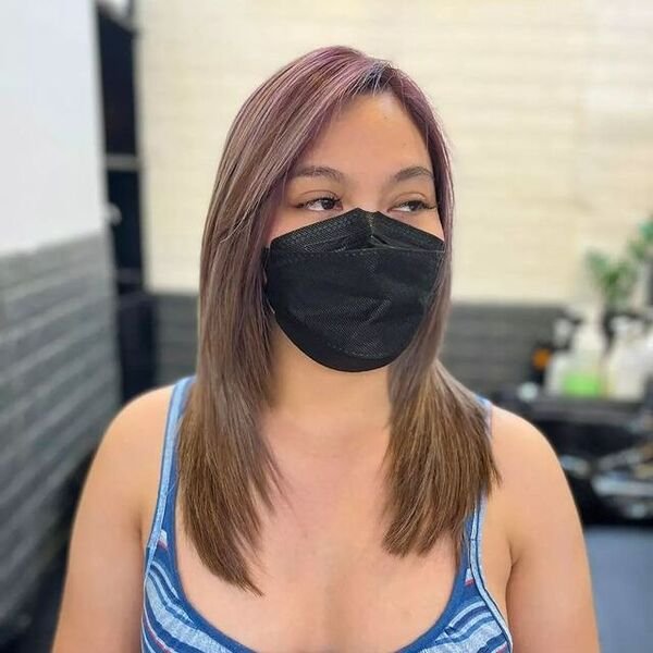 a woman wearing a black facemask