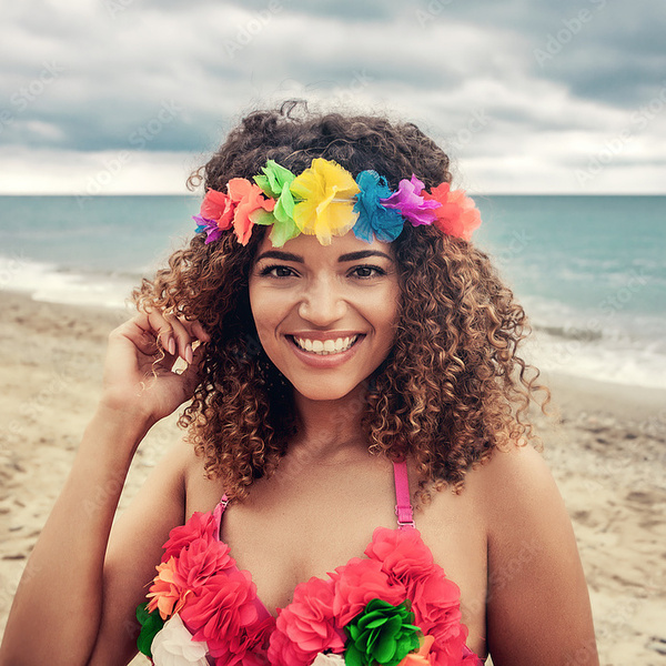 a woman wearing a pink hawaiian bra