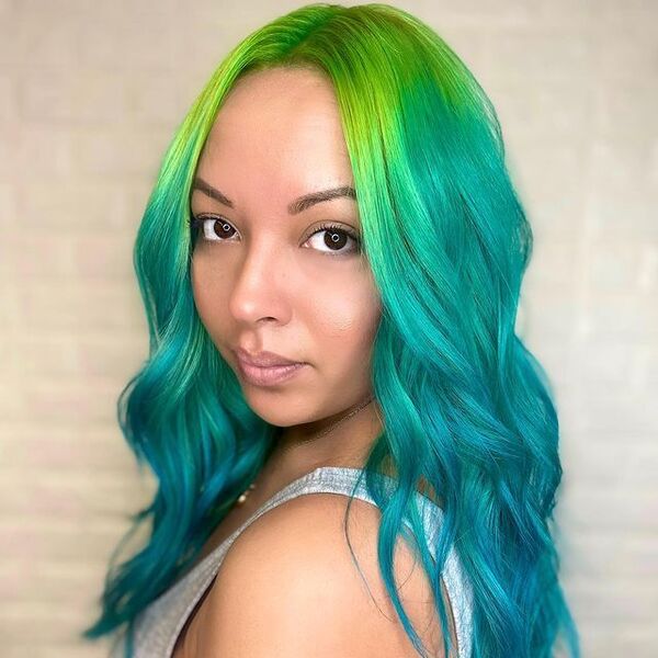 Neon Green to Turquoise Ombre Hair - a woman wearing a gray sleeveless shirt