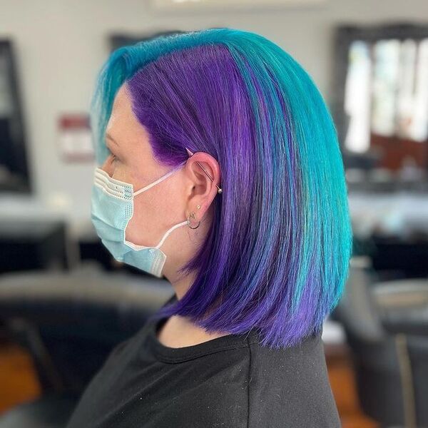 Purple and Turquoise Combo Hairstyle - a woman wearing a surgical facemask