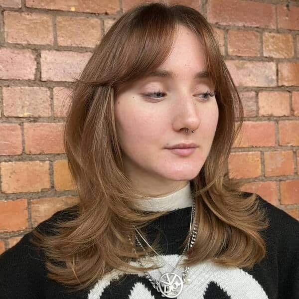 A woman wearing a black jacket