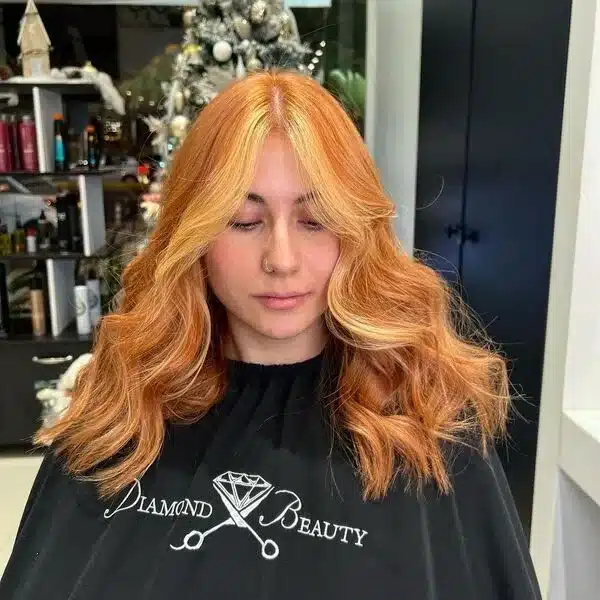 A woman wearing black salon cape