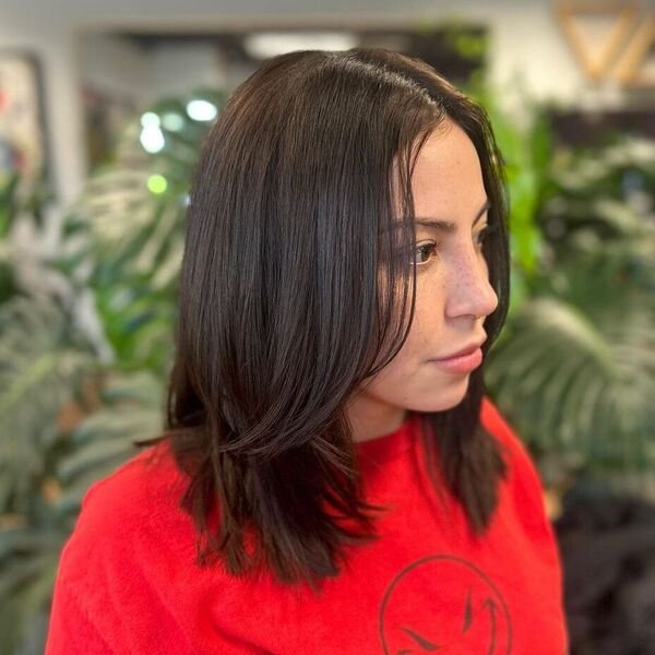 A woman wearing a red jacket