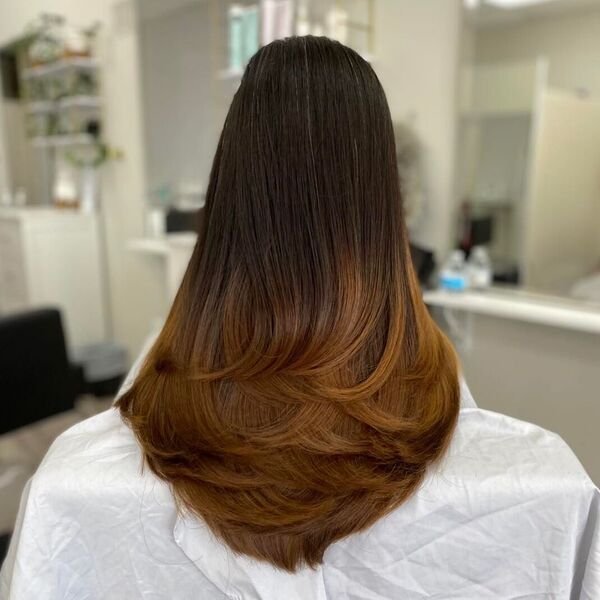 A woman wearing white salon cape