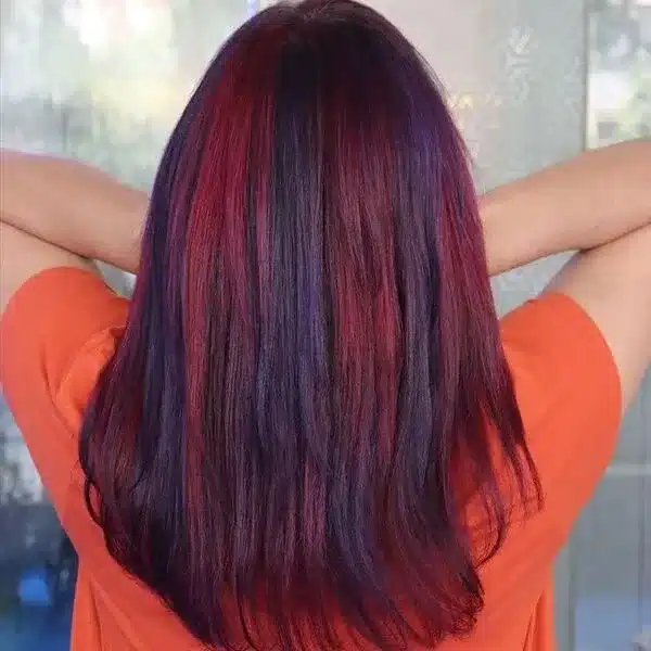 Dark- Colored Layered haircut with Burgundy and Red Chunky Highlights
